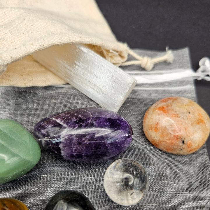 Lilz Luxe Beginner Crystal Set with a white Howlite stretch bracelet, 7 classic polished tumbles, a Clear Quartz mini sphere, and a natural Selenite charging stick. 