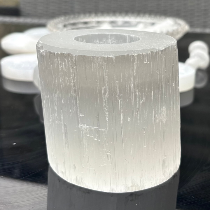 Selenite Tea Light Holder on a patio with furniture in the background