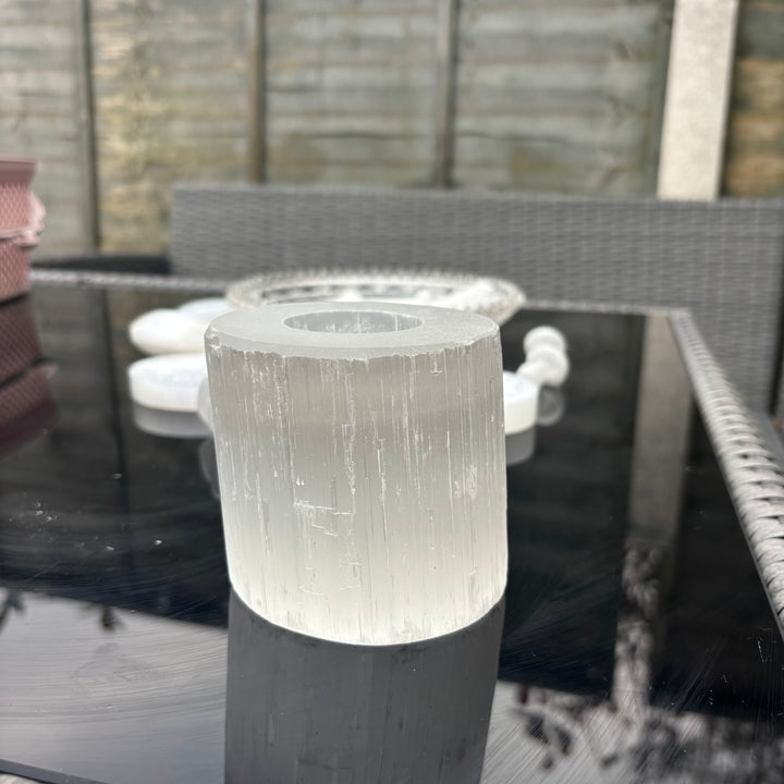 Selenite Tea Light Holder on a patio with furniture in the background