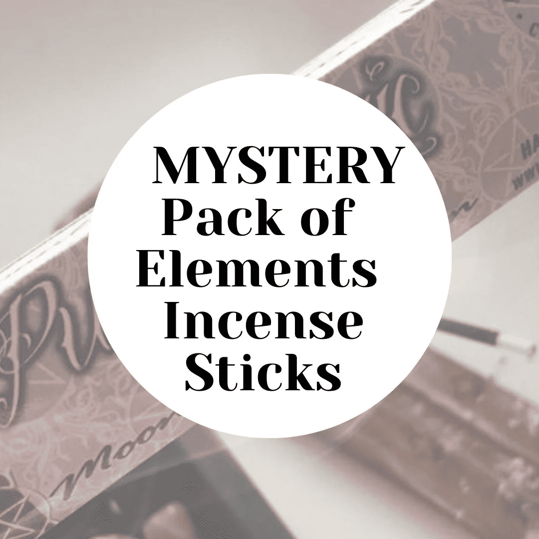 A retail graphic displaying a bold white circular label in the centre with clean black text reading Mystery Pack of Elements Incense Sticks. The minimalist overlay rests against a multi-coloured, out-of-focus background of whimsical Lisa Parker illustrated boxes to hint at an unexpected manifestation routine.