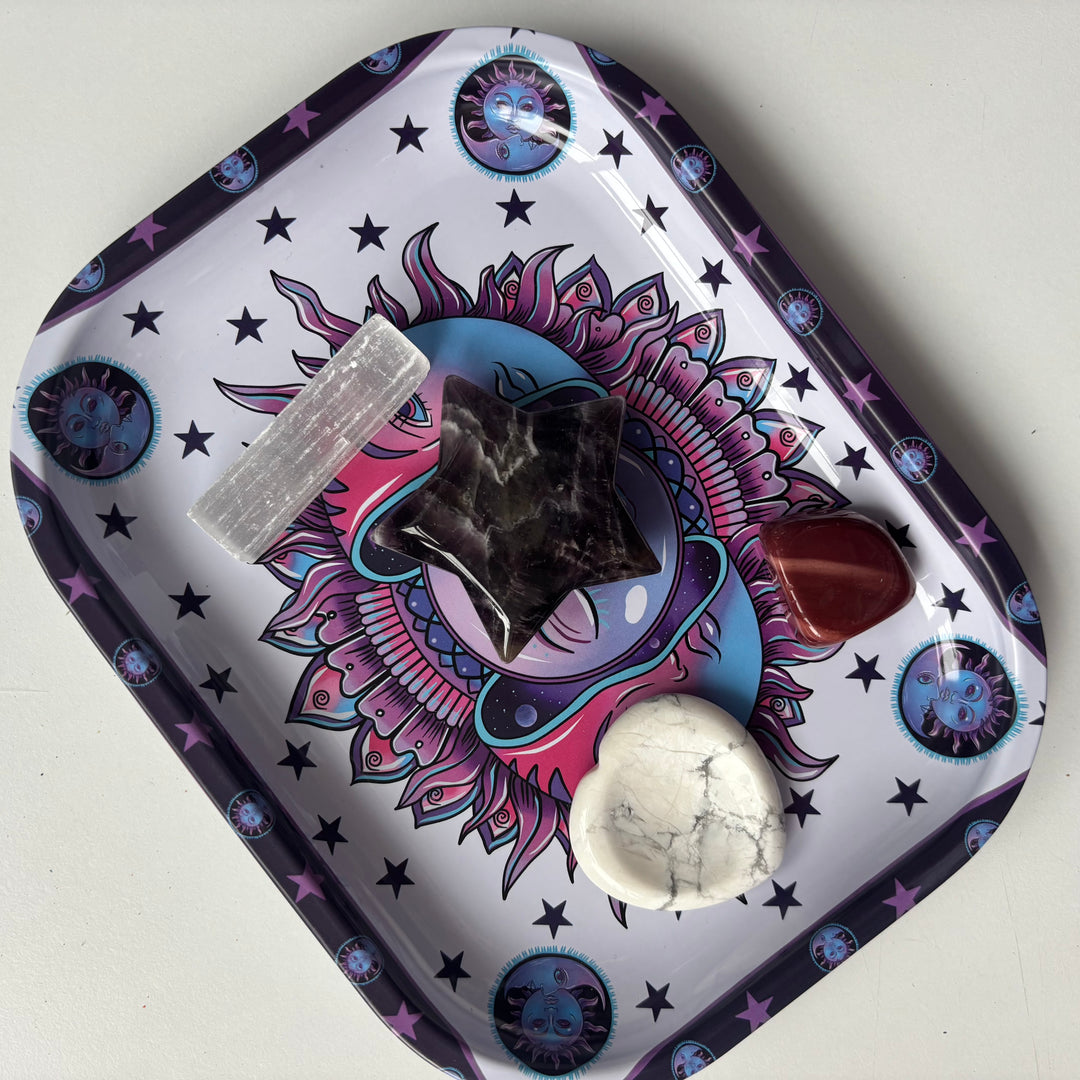 A top-down view of the celestial third eye tray holding a raw crystal cluster and a tumbled stone on a clean surface.