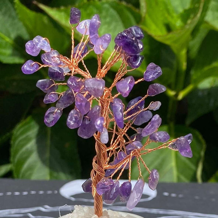 An alternative close-up focus on the detailed canopy of the polished purple amethyst chip tree. The shot highlights how the light catches the natural color zones of the genuine gemstone cluster leaves, perfect for inspiring deep intuition, mental clarity, and spiritual harmony.