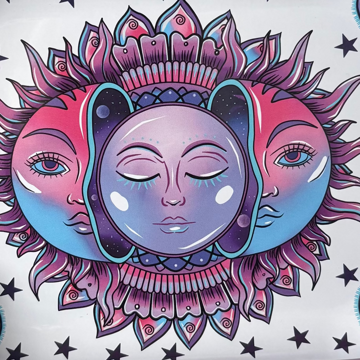 A close-up graphic view of the intricate cosmic sun and crescent moon design on the face of the crystal tray.