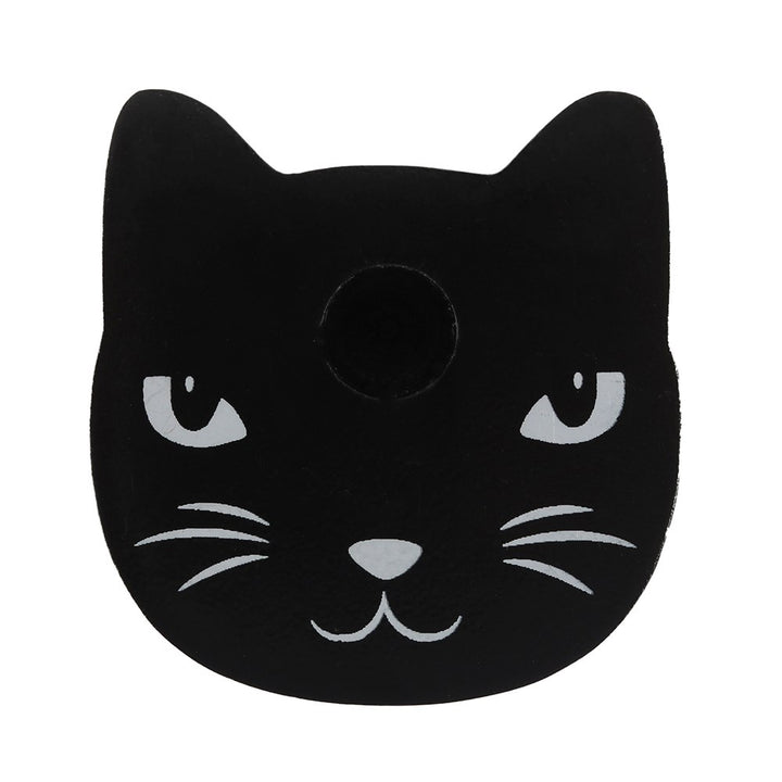 Black ceramic cat head mini ritual candle holder featuring painted white eyes and whiskers on white background.