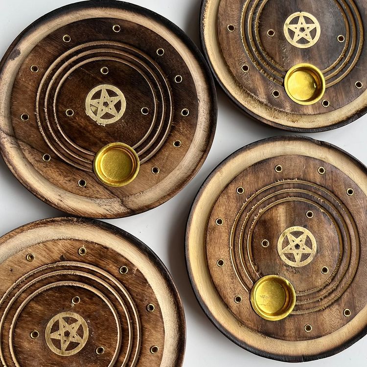 A collection of mango wood incense holders with a gold pentagram design on the top surface, displayed against a white background.