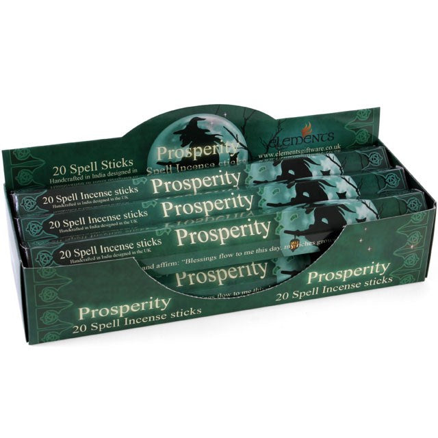 A counter display box containing individual packs of Elements Prosperity Spell incense sticks, featuring dark green and gold mystical themed packaging.